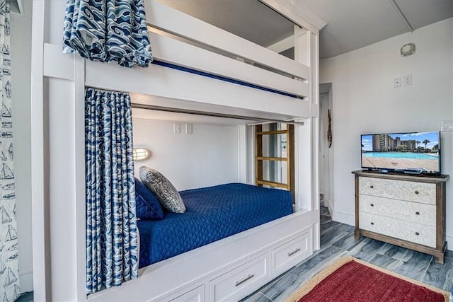 bedroom with wood finished floors