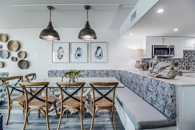 dining space with visible vents, breakfast area, dark wood-type flooring, and recessed lighting