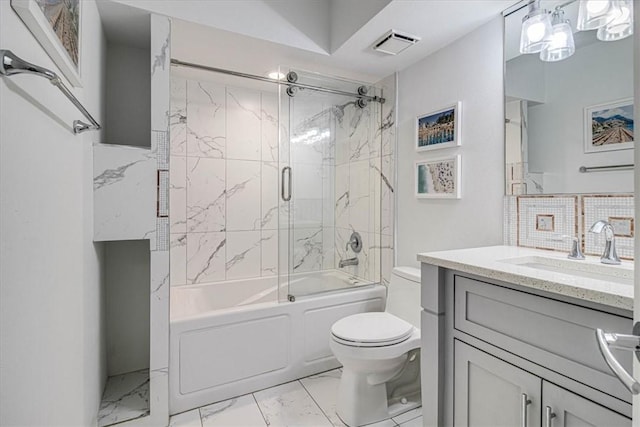 bathroom featuring marble finish floor, shower / bath combination with glass door, vanity, and visible vents