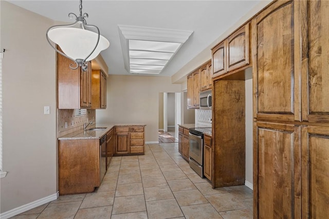 kitchen featuring decorative backsplash, light stone countertops, stainless steel appliances, light tile patterned floors, and decorative light fixtures