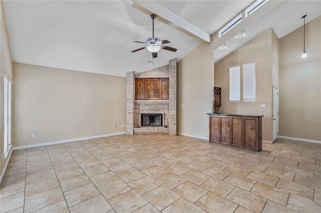 unfurnished living room with a fireplace, beam ceiling, high vaulted ceiling, and ceiling fan