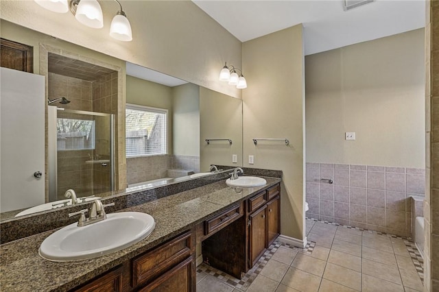 bathroom featuring tile patterned flooring, vanity, and independent shower and bath