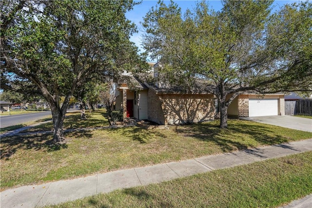 view of front of property featuring a front yard and a garage