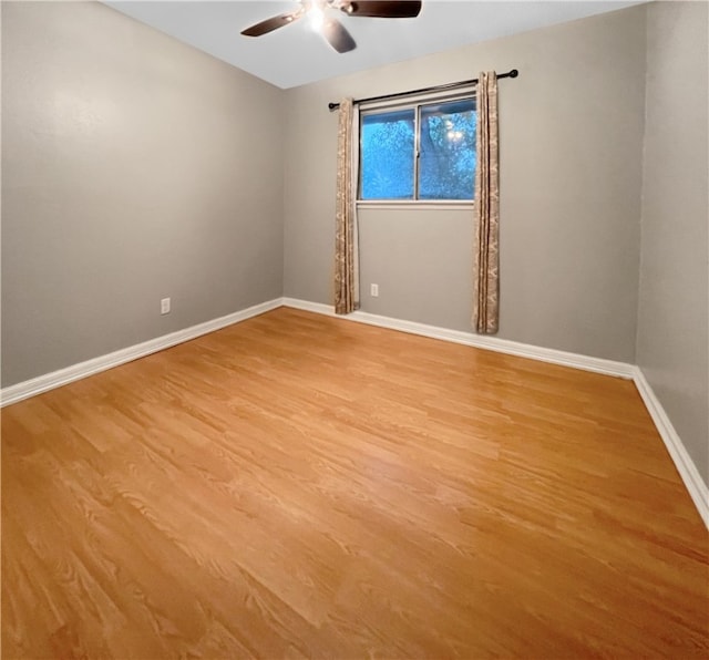 spare room featuring ceiling fan and light hardwood / wood-style floors