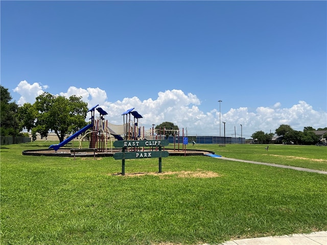 view of playground featuring a lawn