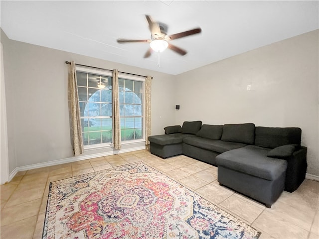 tiled living room with ceiling fan