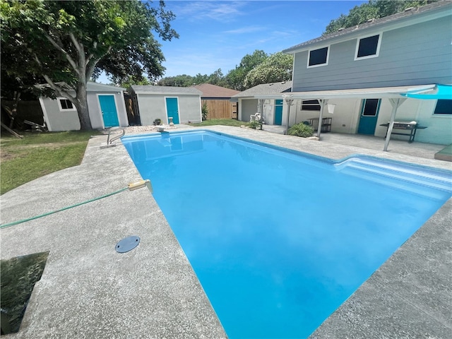 view of pool featuring a patio and an outdoor structure