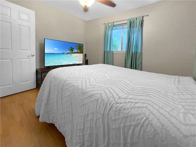 bedroom featuring ceiling fan and light hardwood / wood-style floors