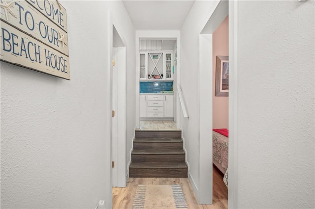 hallway with wood finished floors