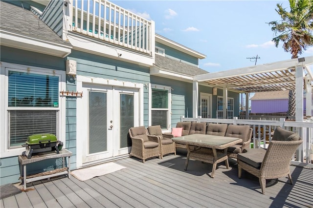 wooden deck featuring an outdoor hangout area, a pergola, and french doors