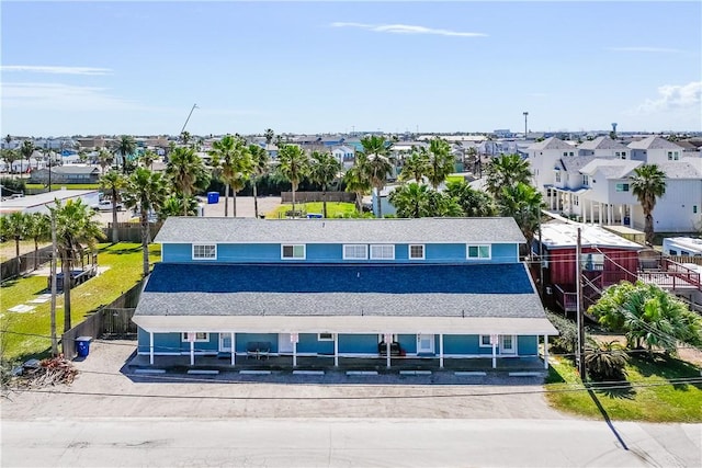 birds eye view of property with a residential view