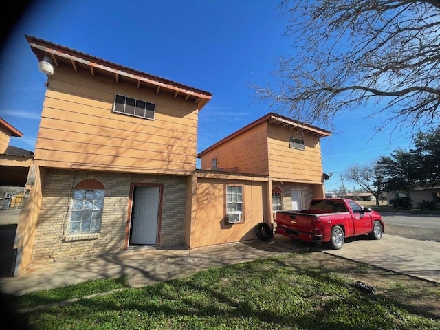 back of property featuring cooling unit