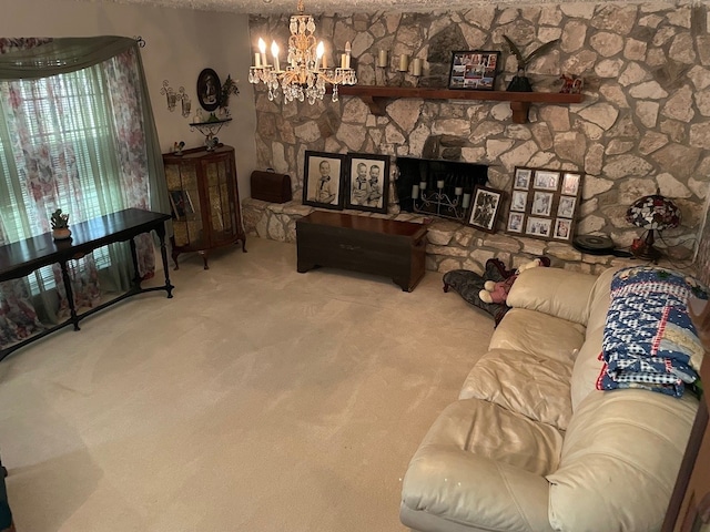 living room featuring a stone fireplace, carpet, and an inviting chandelier