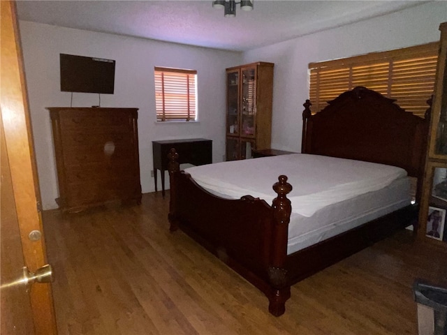 bedroom featuring wood-type flooring