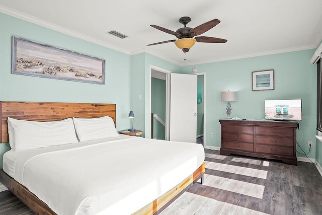 bedroom featuring ceiling fan, dark hardwood / wood-style flooring, and crown molding