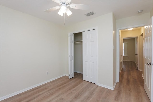 6117 Camwood Dr, Corpus Christi, TX 78415 - unfurnished bedroom featuring light wood finished floors, a closet, baseboards, and a ceiling fan