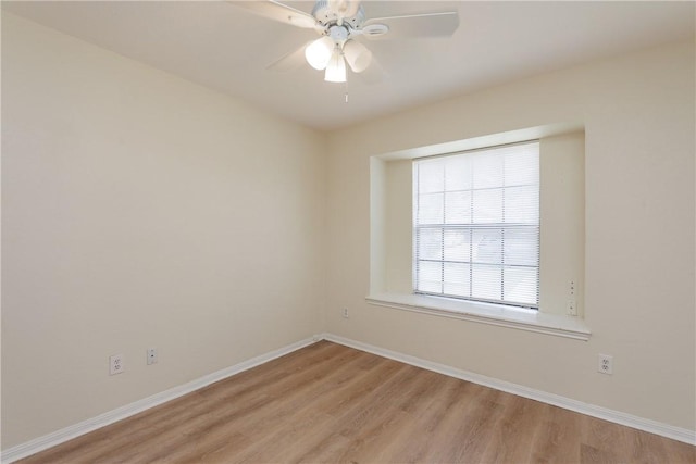 6117 Camwood Dr, Corpus Christi, TX 78415 - unfurnished room with light wood finished floors, baseboards, and a ceiling fan