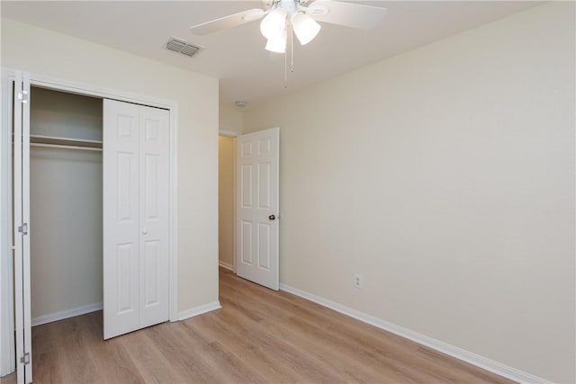 6117 Camwood Dr, Corpus Christi, TX 78415 - unfurnished bedroom with light wood finished floors, a closet, baseboards, and a ceiling fan
