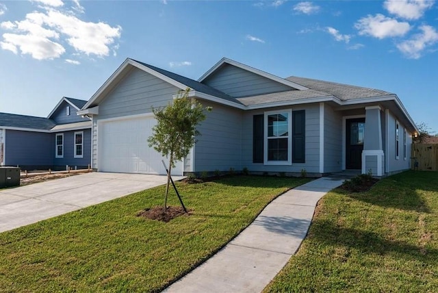 ranch-style house with a garage and a front lawn