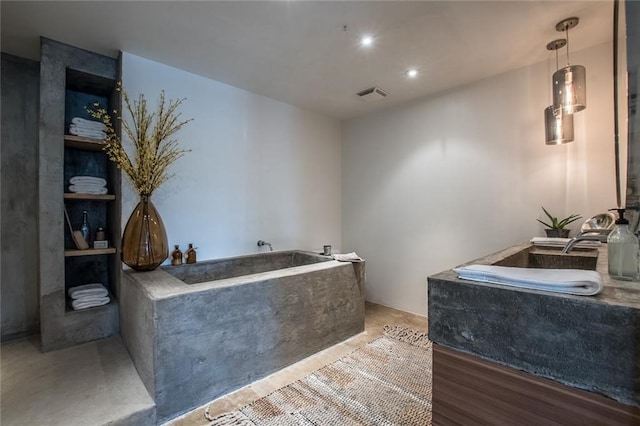 bathroom featuring hardwood / wood-style flooring and a bathing tub