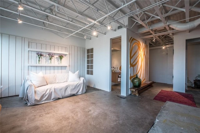 sitting room featuring concrete floors