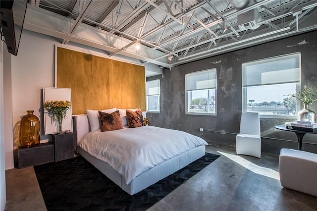 bedroom with concrete flooring