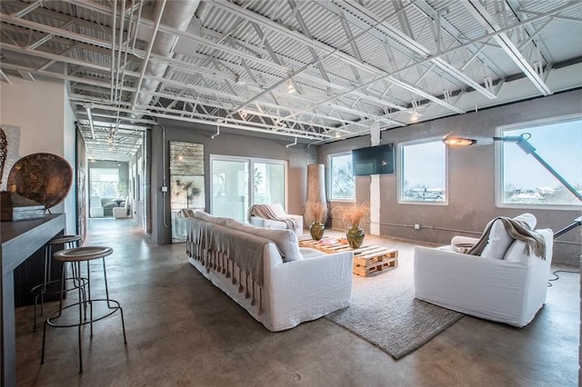 living room with concrete flooring