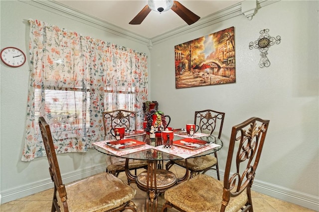 dining area with crown molding and ceiling fan