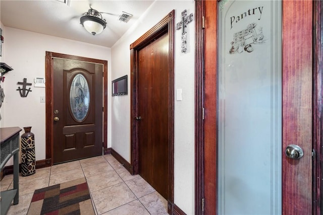 entrance foyer featuring light tile patterned floors