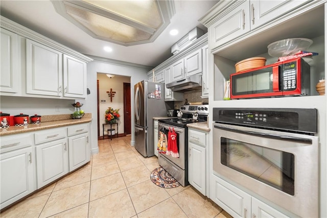 kitchen featuring appliances with stainless steel finishes, white cabinets, decorative backsplash, ornamental molding, and light tile patterned floors