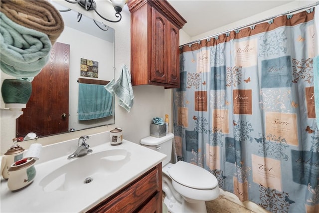 bathroom with vanity, a shower with shower curtain, and toilet