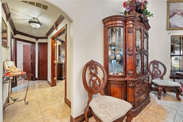 hallway featuring ornamental molding