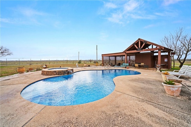 view of pool with an in ground hot tub, a gazebo, and a patio area