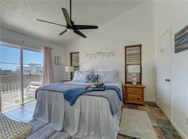 bedroom with ceiling fan, access to exterior, a textured ceiling, and lofted ceiling