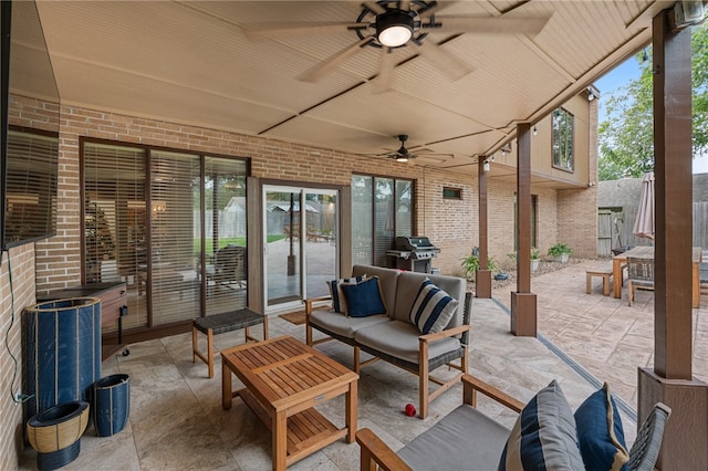 view of patio / terrace featuring an outdoor living space, ceiling fan, and grilling area