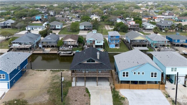 aerial view with a residential view and a water view