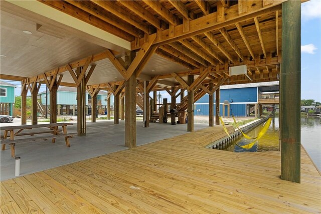 exterior space featuring a water view and a boat dock