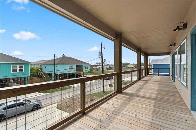 wooden terrace featuring a residential view