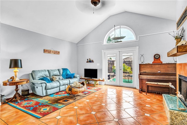 living room featuring french doors, ceiling fan, high vaulted ceiling, and light tile patterned floors