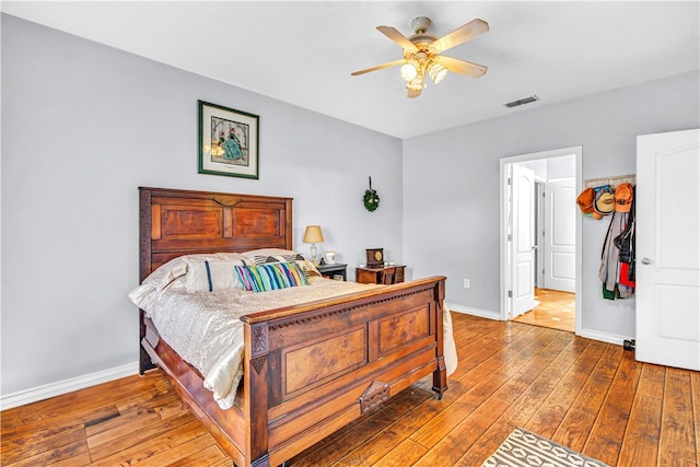 bedroom featuring hardwood / wood-style flooring and ceiling fan