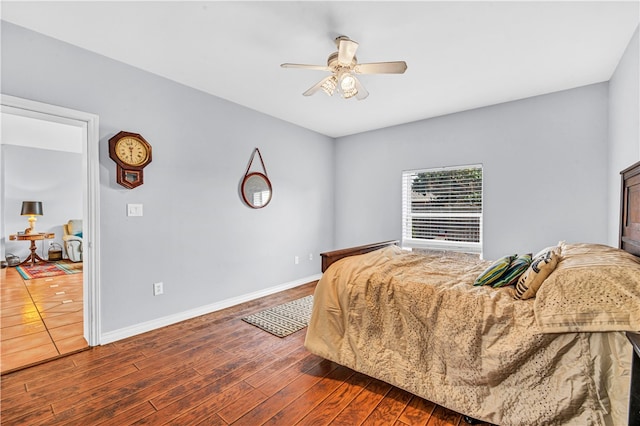 bedroom featuring ceiling fan and dark hardwood / wood-style floors