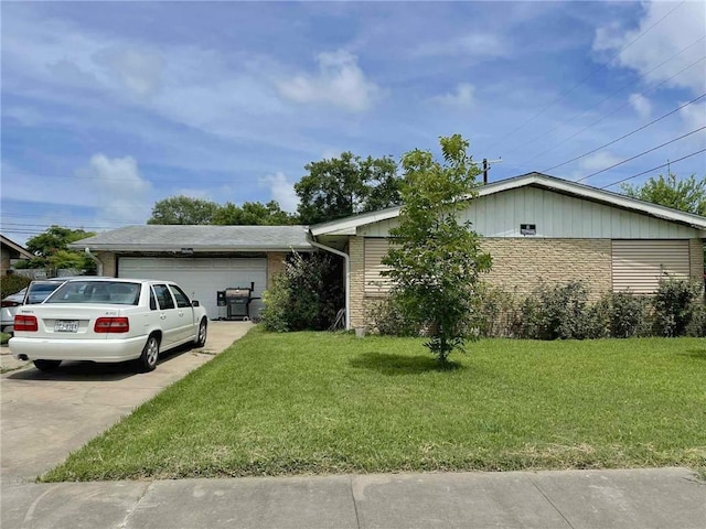 1318 Meadowlane Dr, Corpus Christi, TX 78412 - view of front facade with a garage, a front lawn, driveway, and brick siding