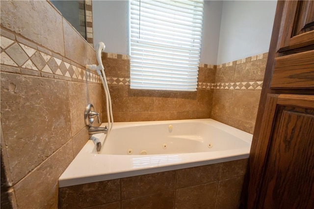 bathroom featuring tile walls and tiled tub