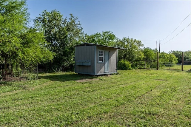 view of outbuilding with a yard