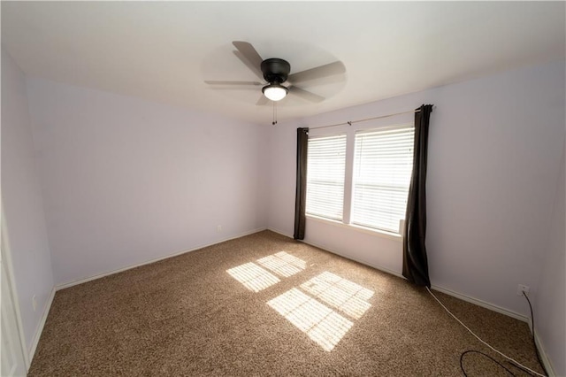 spare room with carpet and ceiling fan