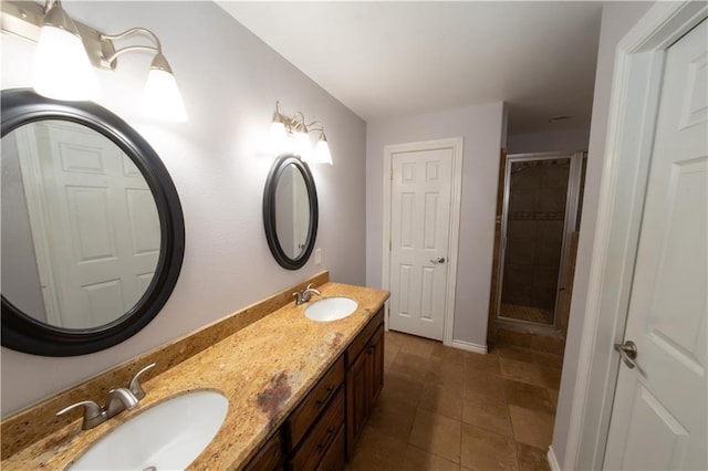 bathroom featuring tile patterned flooring, vanity, and an enclosed shower