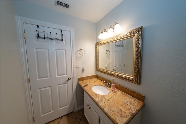 bathroom featuring tile patterned floors and vanity