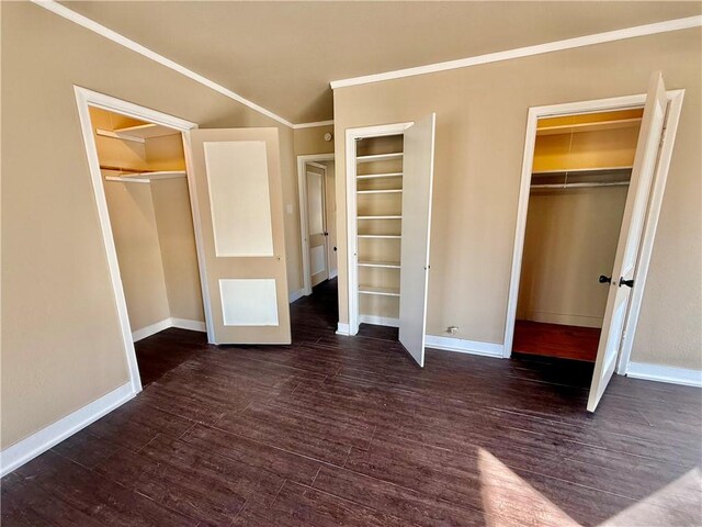 unfurnished bedroom featuring ornamental molding, baseboards, and wood finished floors