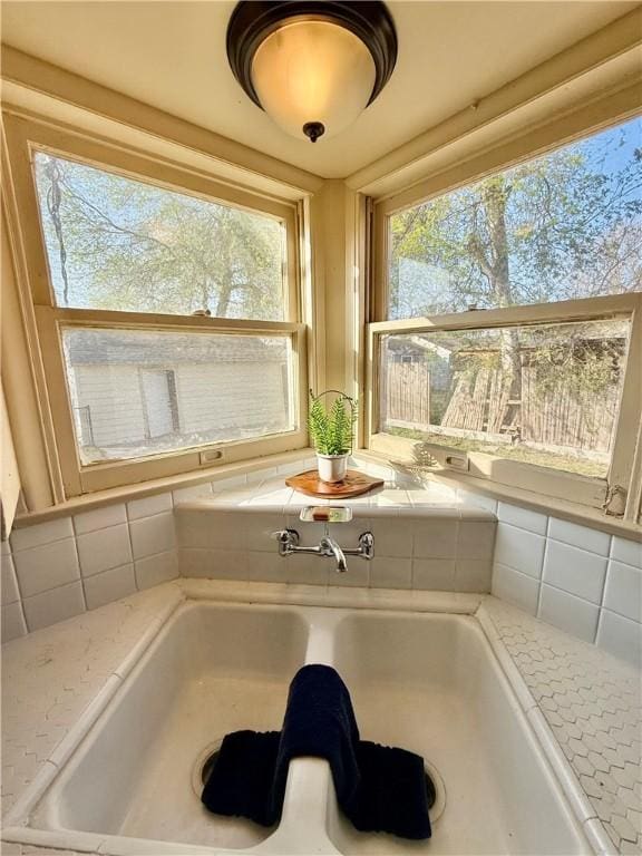 details with a sink and decorative backsplash