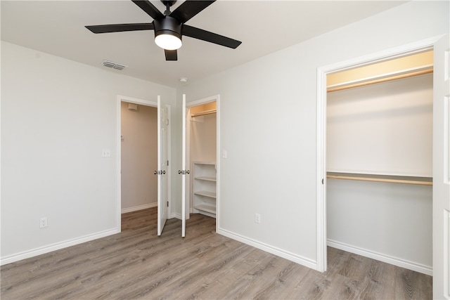 unfurnished bedroom featuring ceiling fan and light hardwood / wood-style flooring